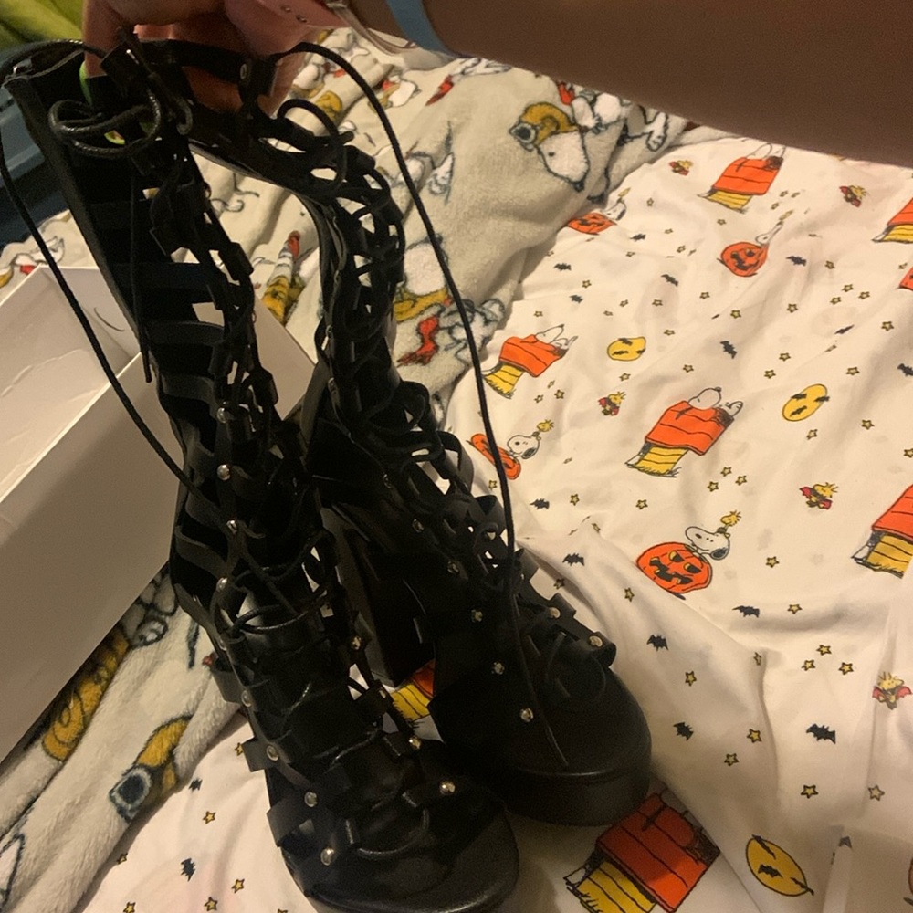 Chunky high heeled boots.